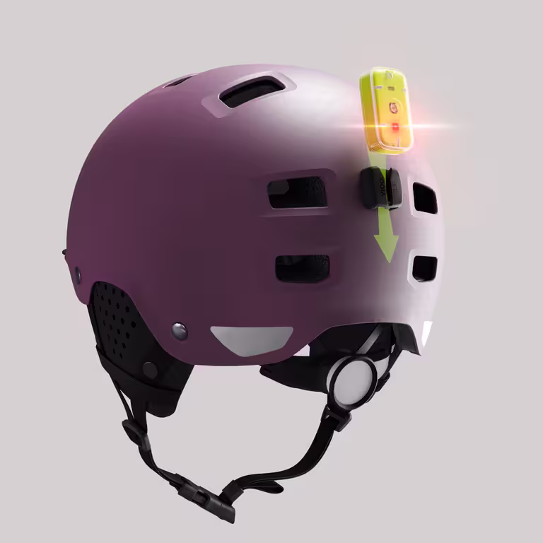 plum helmet with tracker being inserted