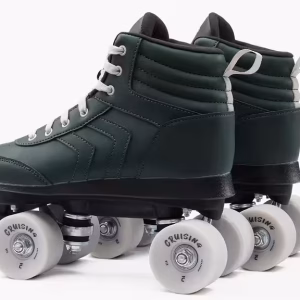 An pair of OXELO runner type, green roller skates with white laces and wheels