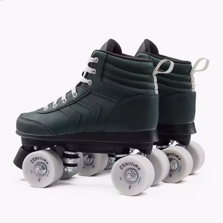 An pair of OXELO runner type, green roller skates with white laces and wheels