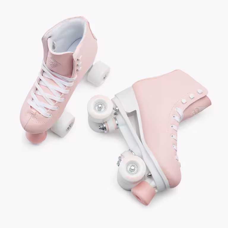A pair of peach OXELO roller skates with white laces and pink and white wheels
