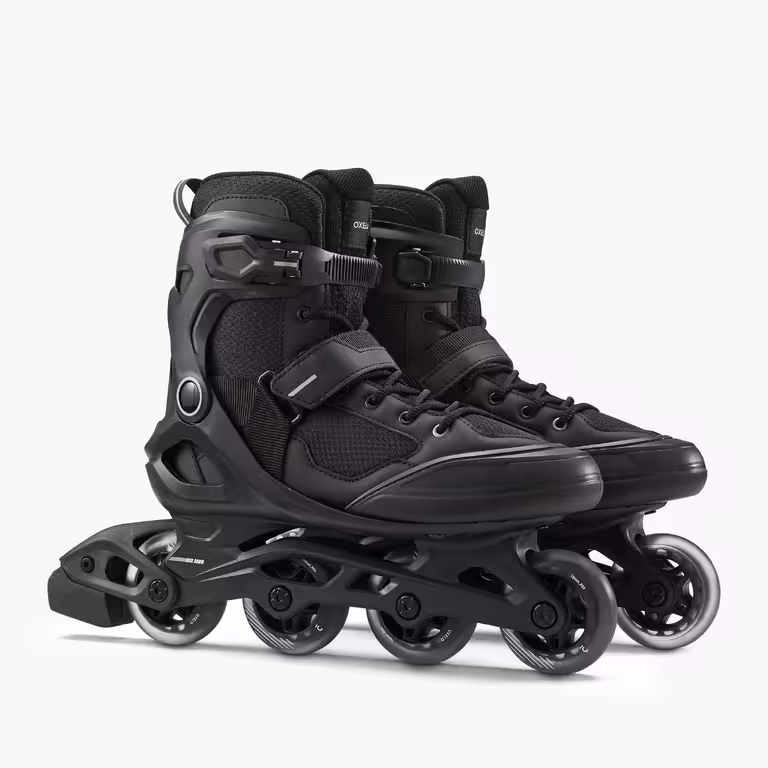 A pair of all black OXELO inline skates