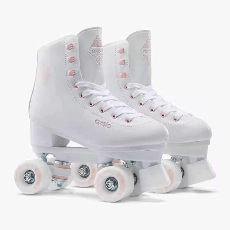 A pair of white OXELO roller skates with pink trim