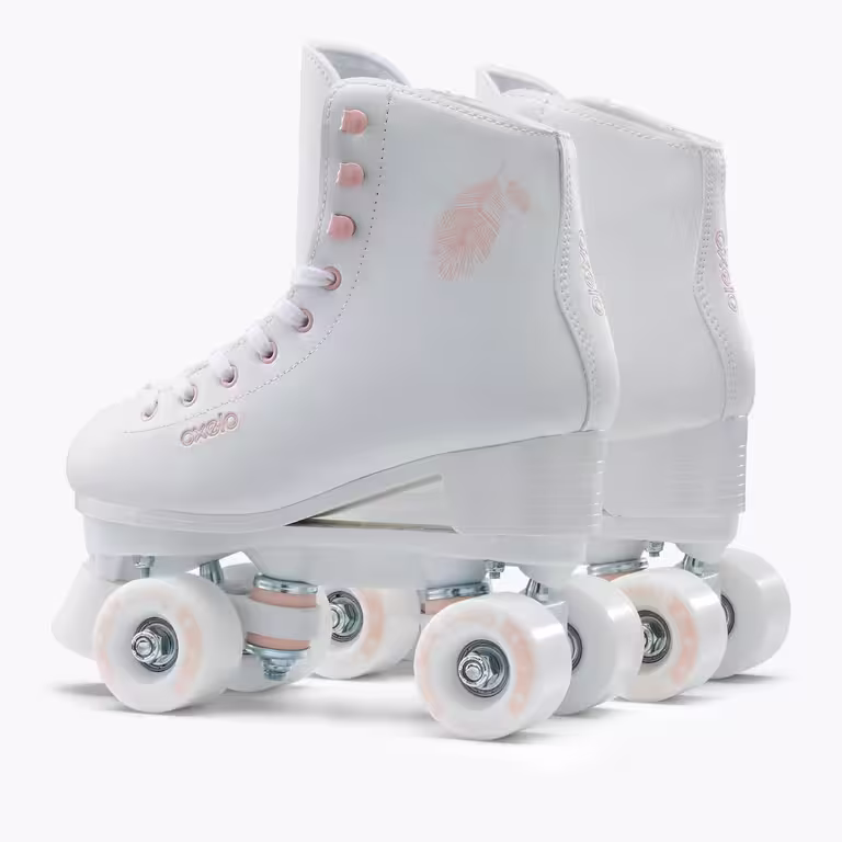 A pair of white OXELO roller skates with pink trim